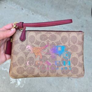 Coach Signature Canvas w/ Rexy and Carriage Motif Small Zip Wristlet. #88771